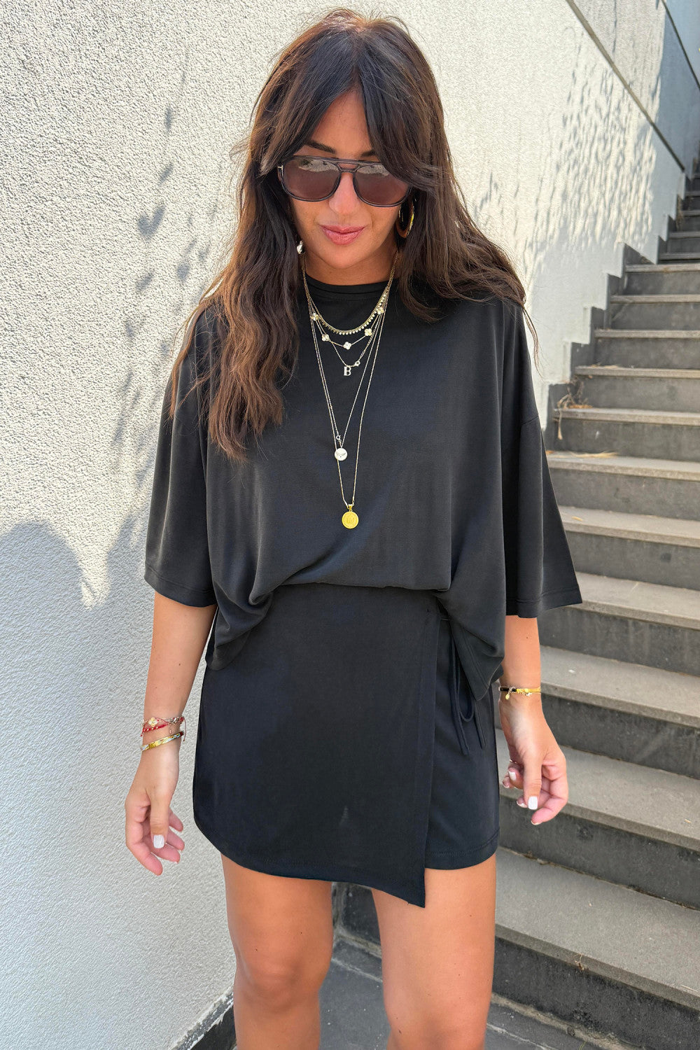 Black solid color oversized tee with tie wrap skort set