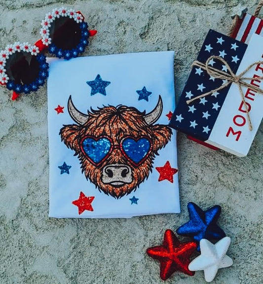 Highland cow with shades